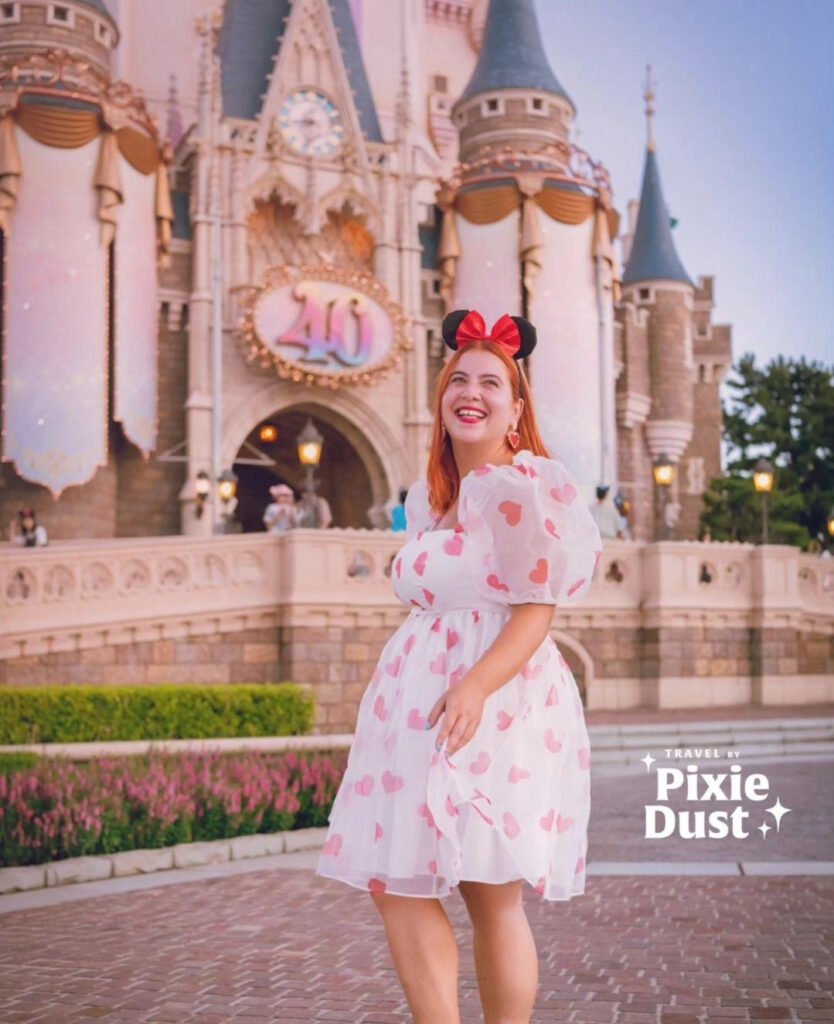 Shanice at Disneyland with the castle in the background 