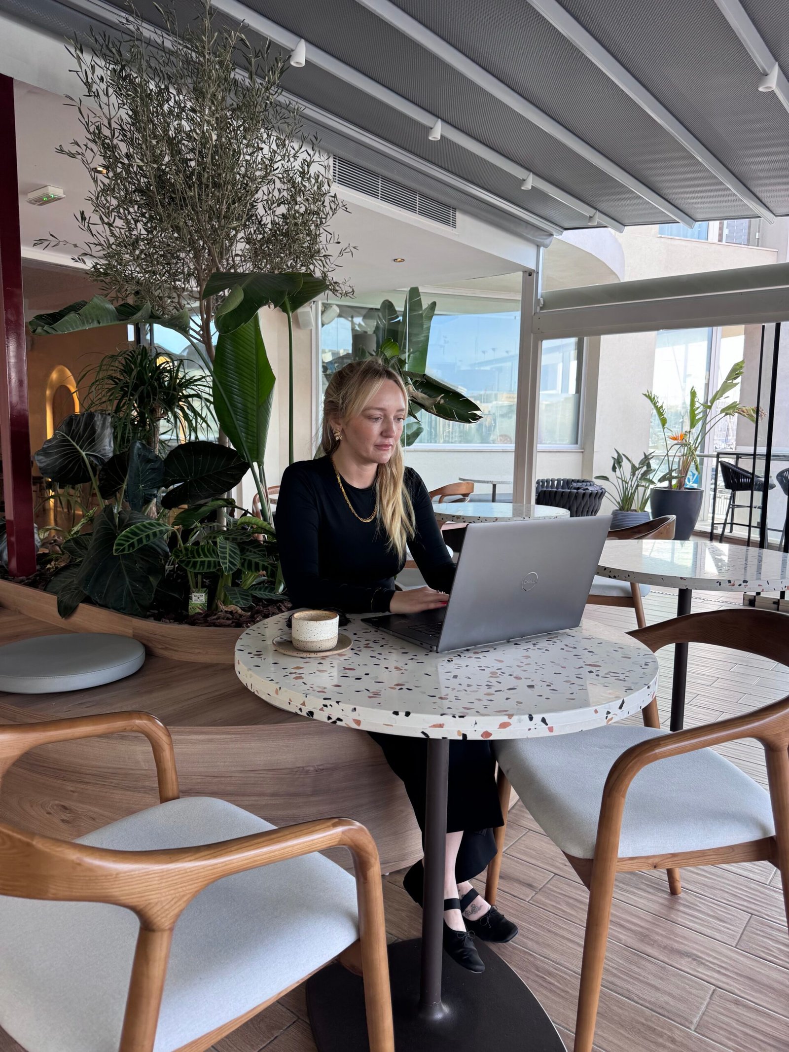 Karla in a coffee shop working